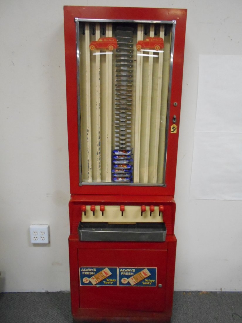 Gordons 5 cent Peanut Vending Machine: 24" x 72" Gordon's decals on front. Owner said it worked until grandkids jammed it. Key is lost so lock must be replaced to open and unjam. Storage door at bottom. All handles are present.