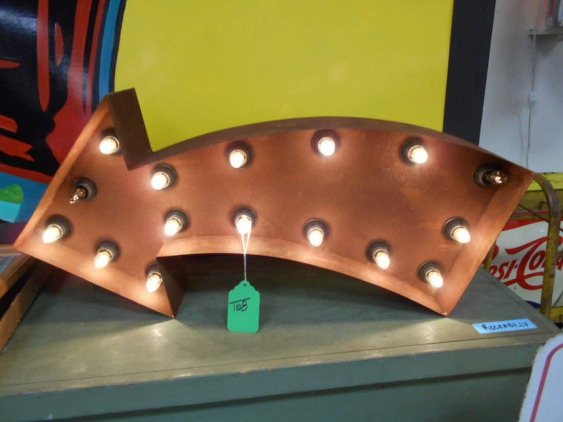 Metal light up arrow sign: 33" x 14" new metal light up arrow sign. 2 bulbs need replaced