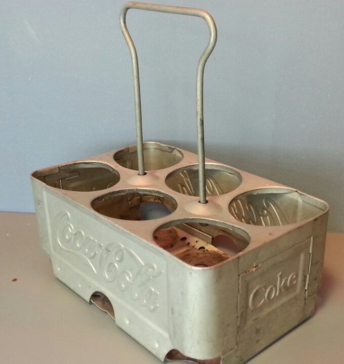 Original Coca Cola aluminum bottle carrier: Embossed Coca cola six pack carrier with handle.
