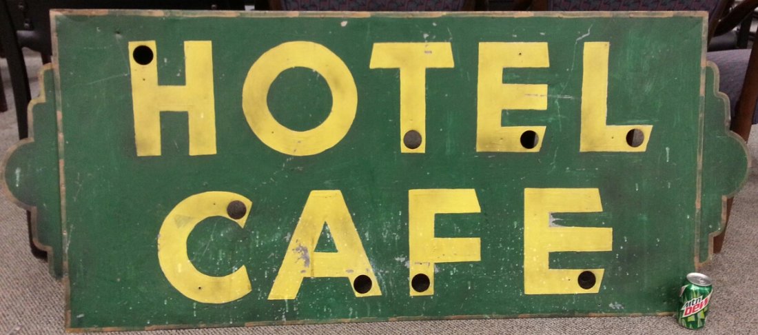 Deco Hotel Cafe advertising sign: 69" x 29" painted Hotel Cafe sign with art deco design on the ends. The sign was originally neon. No neon is present on this sign.