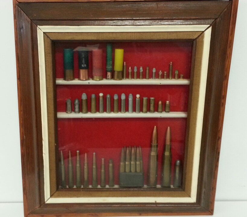 Shadow box of bullets & shells: Neat display of ammo in a nicely framed shadow box.