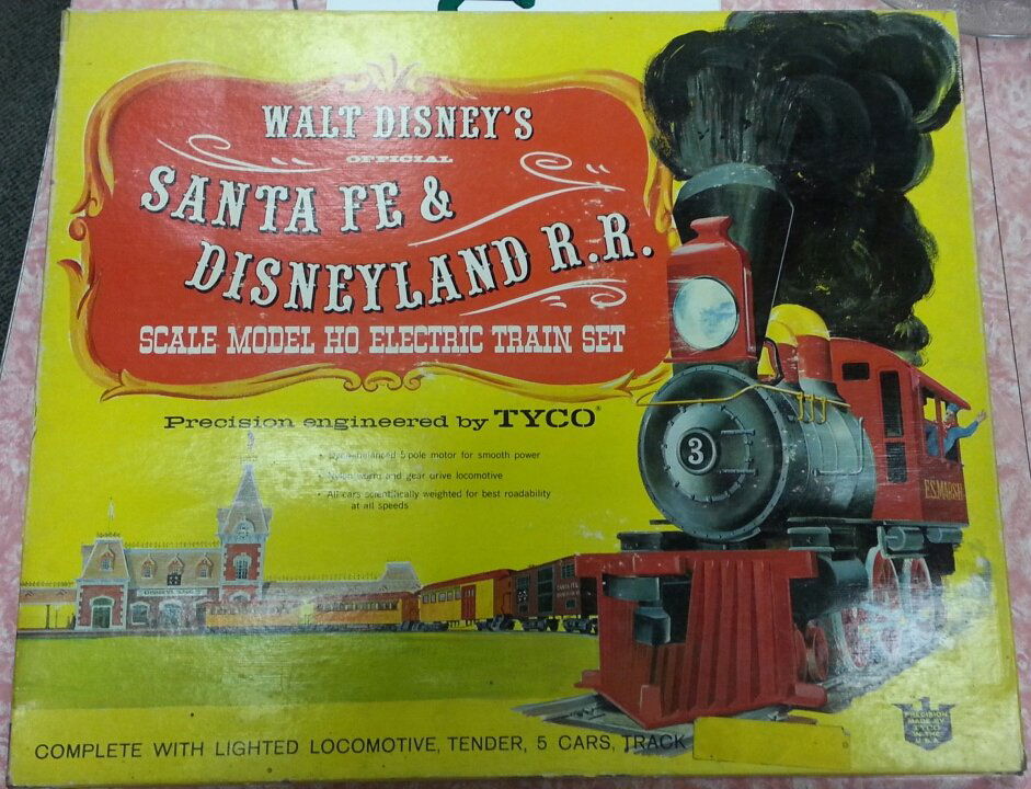Disney Santa Fe & Disneyland R.R. elecric train: Electric Tyco HO scale train set. Comes with original box and inner boxes. Train engine with all five cars.