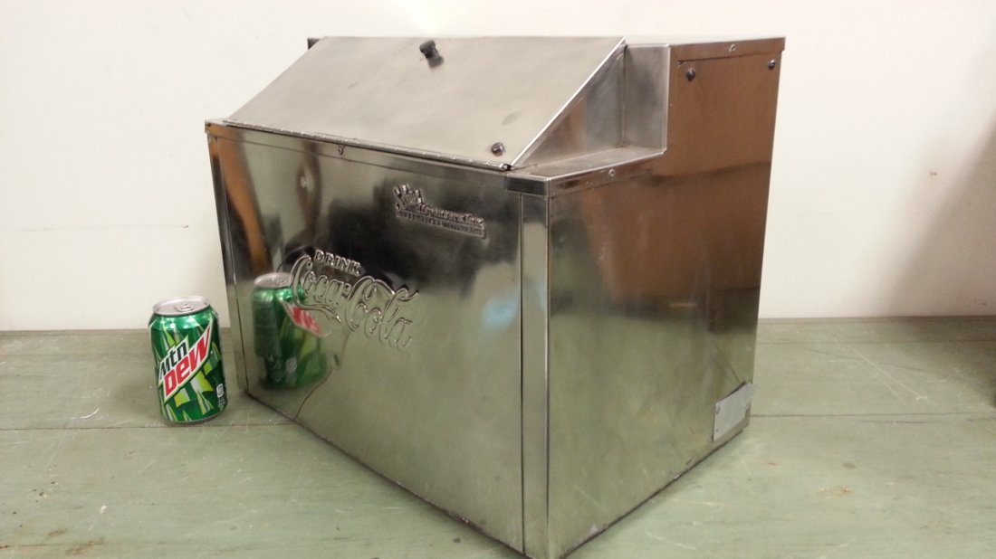Embossed Coca Cola Selmix dispensers Inc.: Chrome embossed insulated Coca Cola container with lid. These were used with soda fountains. This container can be used as a cooler or warmer.