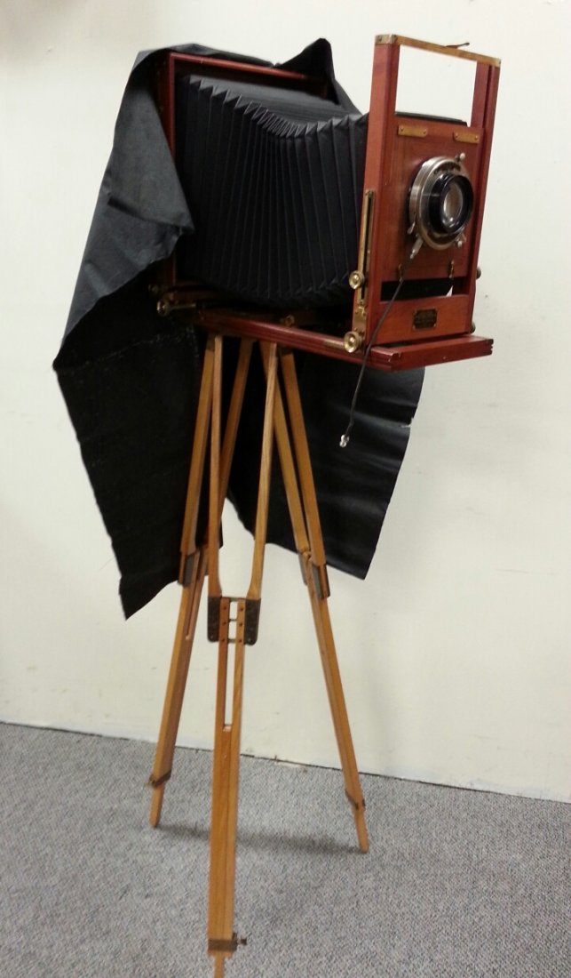 Kodak Eastman View Camera No.1: Manufactured from the Eastman Kodak Company from 1914 - 1924. This camera was an evolution of the improved Empire State. Constructed with mahogany body and cherry wood base, black fabric bellows and b