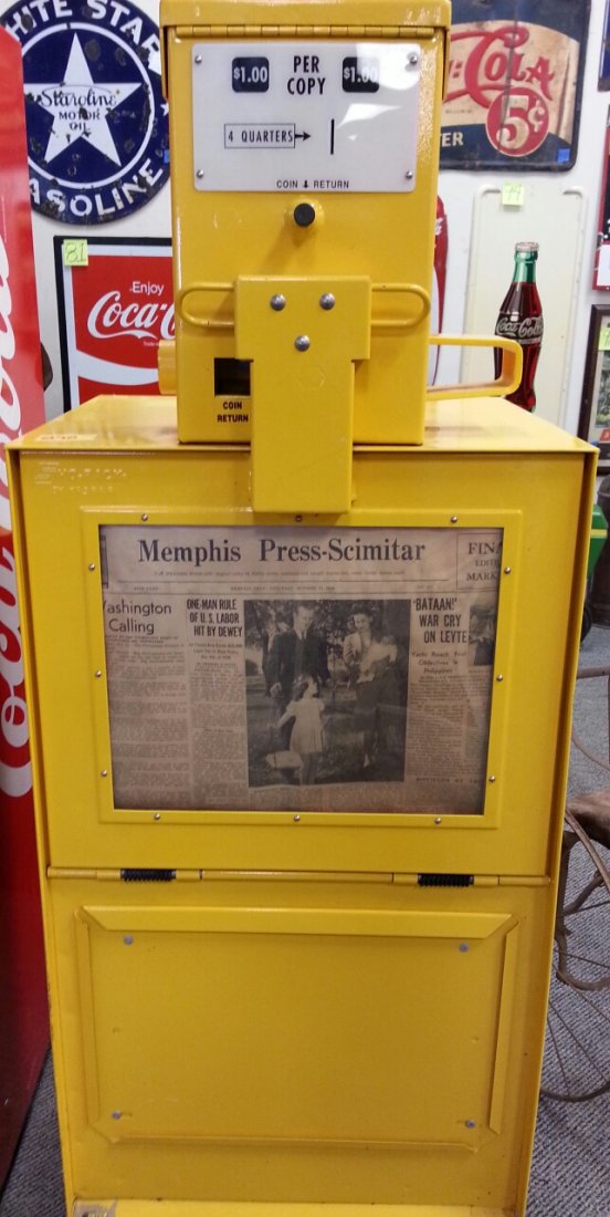 The Mid-South Tribune Newspaper Machine: Original coin operated newspaper box. Box is painted yellow and comes with a 1944 Memphis Press Scimitar newspaper in the window.