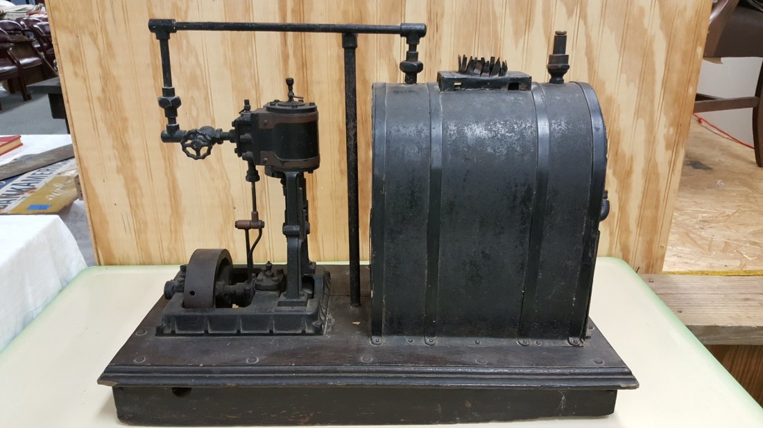 Early 1900\'s salesman sample steam engine: 24"w x 17"h RARE metal and iron steam engine mounted on wood base. Appears to be a sample or model for a much larger system. All parts appear to operate the way they should.