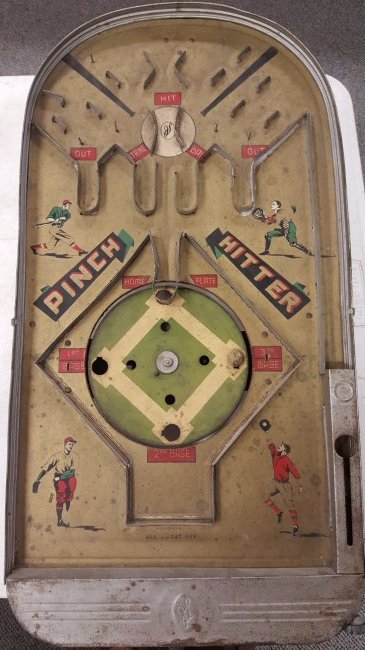 Original Early Pinch Hitter Table Top Baseball Game: "Pinch Hitter" Baseball table top pinball game with windup revolving tin litho baseball diamond. Square key not included. Graphics are excellent. Ball included