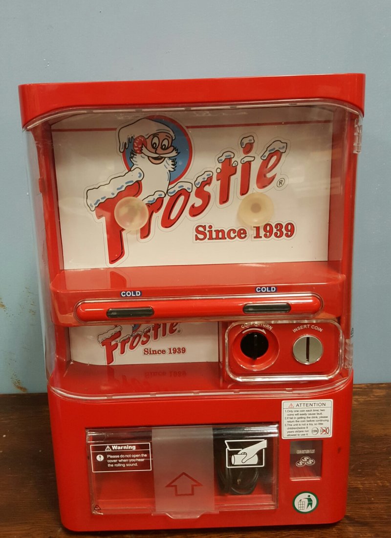 Frostie Root Beer Mini Coin Op Cooler: 12 "w x 18"h x 12"d 25 cent mini cooler that vends 8 cans and pre cools 2 cans. Cool Frostie graphics.