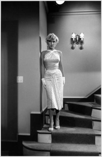 Marilyn Monroe On the Staircase Photo by Sam Shaw: Description of image: Marilyn Monroe on the set of "The Seven Year Itch", 20th Century-Fox, Hollywood', CA, 1954. This photo was shot by Sam Shaw between takes of a scene that took place on a staircas