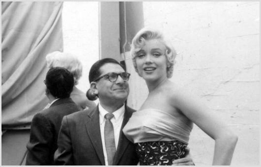 Marilyn Monroe and Sidney Skolsky Photo by Sam Sh: Description of image: Marilyn Monroe with the gossip columnist, writer, critic, actor and producer Sidney Skolsky (1905-1983)who wrote a book about Marilyn in 1954. This image was taken by Sam Shaw ne