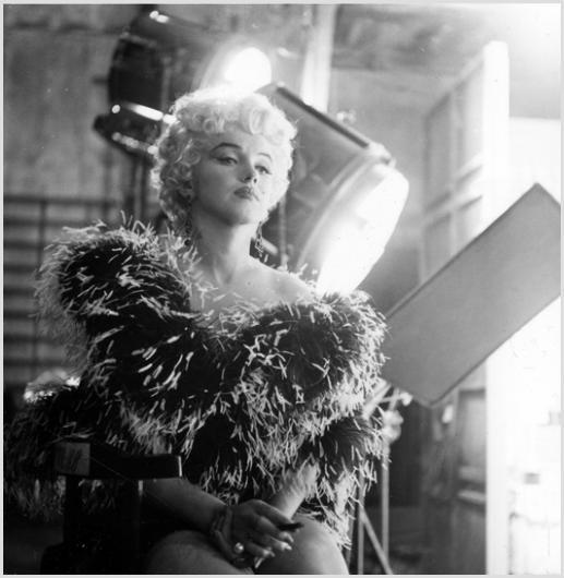 Marilyn Monroe, Take Five, Photo by Sam Shaw: Description of image: Marilyn Monroe backstage on the set of "The Seven Year Itch", 20th Century-Fox, Hollywood, California, 1954. Sam Shaw took this photo as Marilyn Monroe was taking a break from a