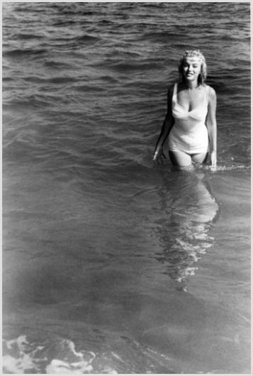 Marilyn Monroe on the Beach, Easthampton #2 Shaw: Description of image: Marilyn Monroe projecting a sultry pose for Sam Shaw, while enjoying the beach in Easthampton, near her summer house in Amagansett, NY, 1957. Because Marilyn Monroe was born in C