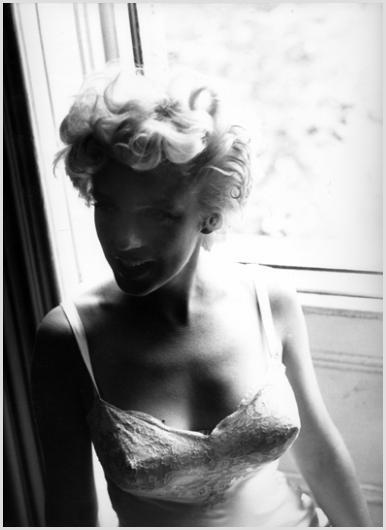 Marilyn Monroe Near the Window #2 Photo By Sam Sh: Description of image: Marilyn Monroe on location in New York City for The Seven Year Itch, 1954. Sam Shaw was photographing on location in a brownstone apartment on 61st Street in Manhattan where Dire
