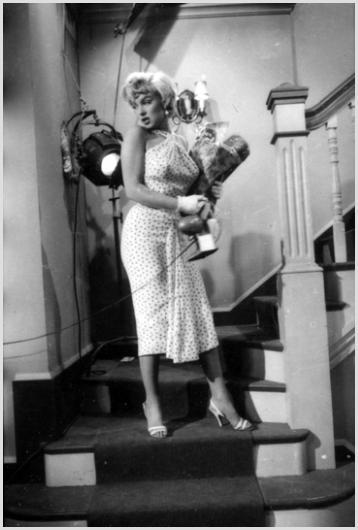 Marilyn Monroe, Staircase Production Shot by Sam: Description of image: Marilyn Monroe on the set of "The Seven Year Itch", 20th Century Fox Studios, Hollywood, CA, 1954. Sam Shaw photographed Marilyn in between takes, during a production shot on the