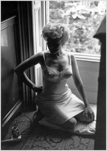 Marilyn Monroe Near the Window #3 Photo by Sam Sh: Description of image: Marilyn Monroe on location in New York City for "The Seven Year Itch", 1954. Sam Shaw was photographing on location in a brownstone apartment on 61st Street in Manhattan where Di
