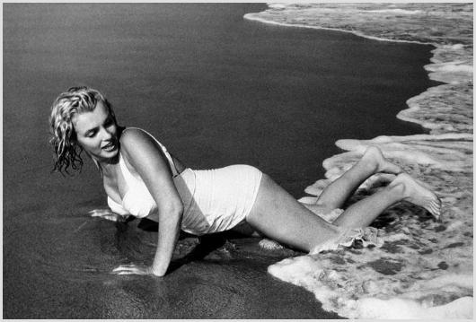 Marilyn Monroe on the Beach, Easthampton #3 Shaw: Description of image: Marilyn Monroe projecting a sultry pose for Sam Shaw, while enjoying the beach in Easthampton, near her summer house in Amagansett, NY, 1957. Because Marilyn Monroe was born in C