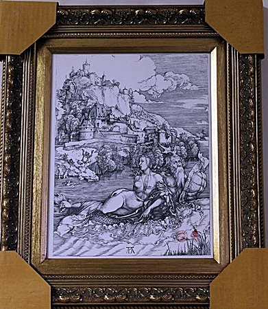 Framed Albrecht Dürer-The Sea Monster Engraving: By Albrecht Dürer, Framed The Sea Monster Engraving. It shows a voluptuous naked middle-aged woman riding on the back of a male creature who is half-man, half-fish. The man wears a beard and antlers,