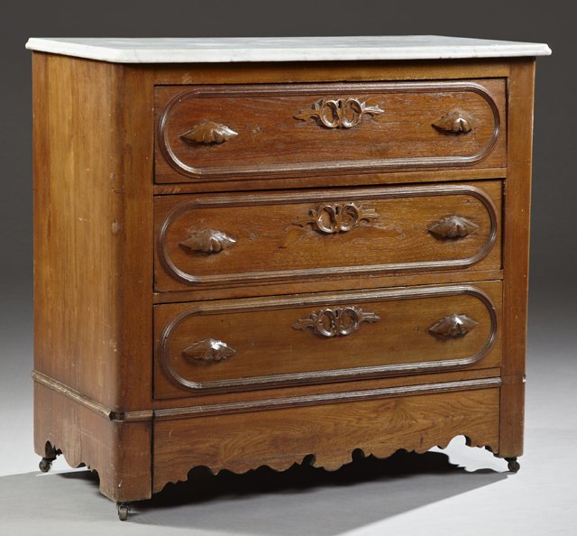 American Late Victorian Marble Top Chest, c.1890, the: American Late Victorian Marble Top Chest, c.1890, the ogee edge rounded corner highly figured white marble on a base with three drawers with leaf pulls above a bottom "secret" drawer, H.- 36 1/2 in., 