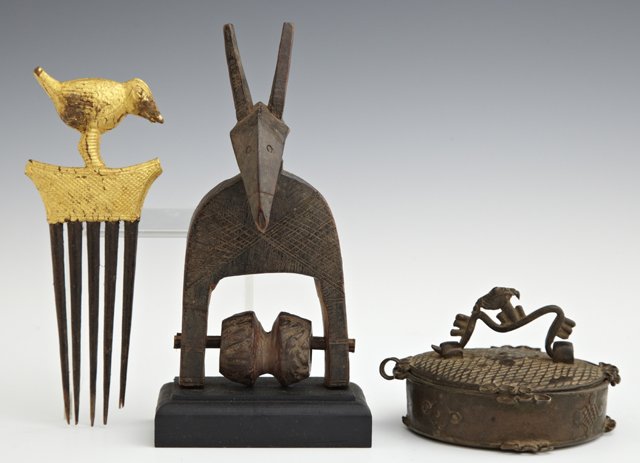 Three African Items, 20th c., consisting of a gilt comb: Three African Items, 20th c., consisting of a gilt comb with a bird handle, a circular bronze box, and a carved wooden animal figure weaver pulley. (3Pcs.)