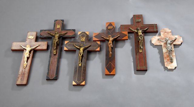 Group of Six French Crucifixes, 20th c., five of inlaid: Group of Six French Crucifixes, 20th c., five of inlaid wood and one of soapstone, Largest- H.- 13 7/8 in., W.- 7 1/2 in., D.- 1 3/8 in.