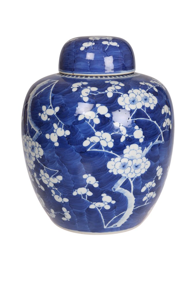 A large Chinese blue and white covered vase: A large Chinese blue and white covered vase, the shouldered ovoid body and domed cover painted with prunus against a cracked ice ground, undercut foot, bears four character Kangxi mark, but later. 29c