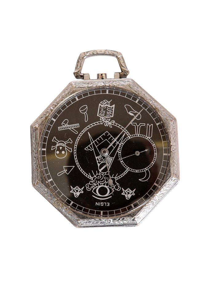 An Elgin white-metal cased Masonic pocket watch: An Elgin white-metal cased Masonic pocket watch, the octagonal case with engine-turned back, enclosing a black dial with Masonic emblems picked out in white, subsidiary seconds, in a fitted box. 43mm