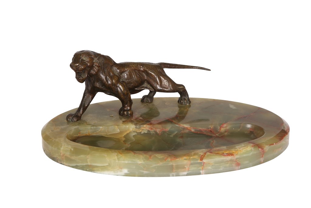 An Austrian bronze model of a tiger, modelled stalking: An Austrian bronze model of a tiger, modelled stalking, on a polished onyx plinth. 24cm wide