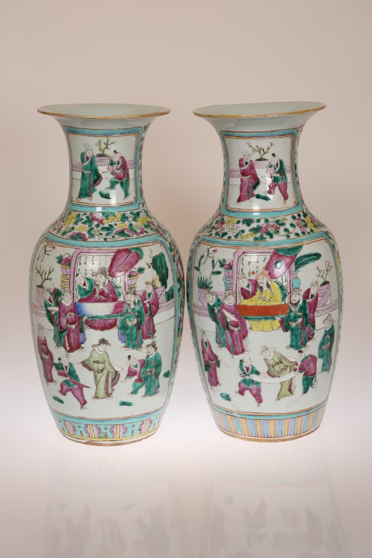 A LARGE PAIR OF CANTONESE ENAMEL DECORATED VASES,: A LARGE PAIR OF CANTONESE ENAMEL DECORATED VASES, probably 19th Century, painted with opposing panels of figures in everyday life, unmarked. 44cm high