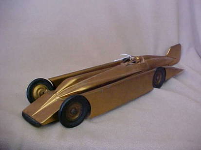 Kingsbury Dayton Gold Arrow race car.: Kingsbury Dayton Gold Arrow race car. Metal possible original paint. Measures 19-3/4"long x 3"tall x 4-1/4"wide.