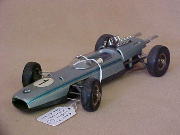 BMW by Schuco Formula race car. #1: BMW by Schuco Formula race car. Original paint, minor scratches from age & usage. Measures 10"long x 2-1/2"tall x 4-1/2"wide.