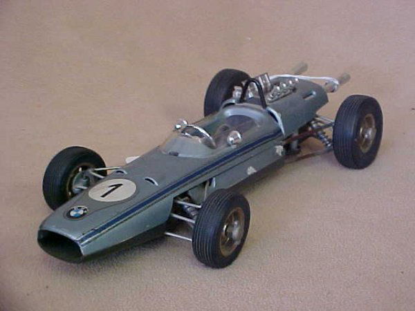 1960's BMW Formula race car by Schuco #1: 1960's BMW Formula race car by Schuco #1. Independent suspension & differential work. Measures 9-3/4"long x 2-1/2"tall x 4-1/4"wide.