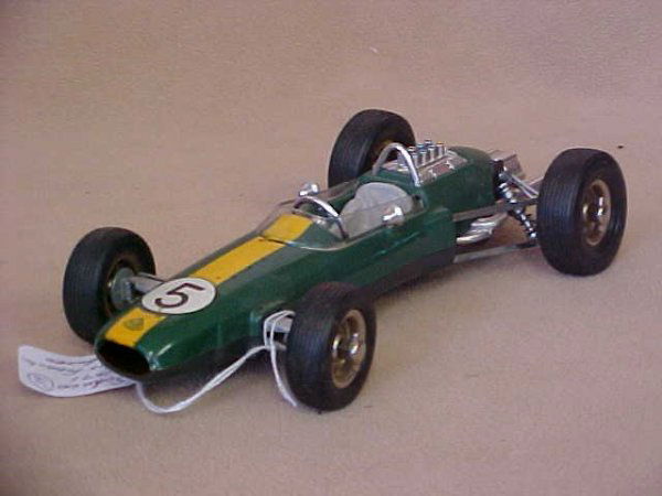 Schuco #1071 Lotus Formula 1 race car w/box.: Schuco #1071 Lotus Formula 1 race car w/box. Near mint conditon. Minor wear from age. Measures 8-3/4"long x 2"tall x 4"wide.