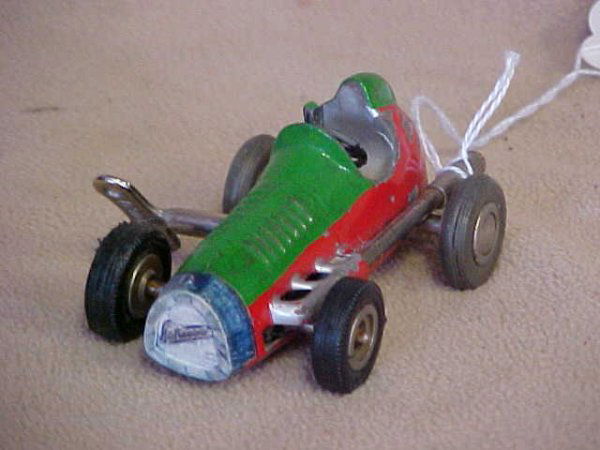 1950's Clockwork race car by Schuco. Wind up: 1950's Clockwork race car by Schuco. Paint scratches & wear from age & usage. Measures 3-1/4"long x 1-1/2"tall x 2-1/2"wide.