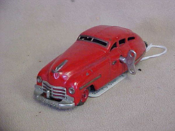 Pre 1952 Schuco auto "Fex 111" wind up original: Pre 1952 Schuco auto "Fex 111" wind up original paint. Needs one tire. Paint scratches from age & usage. Measures 5-1/2"long x 2"tall x 2"wide.