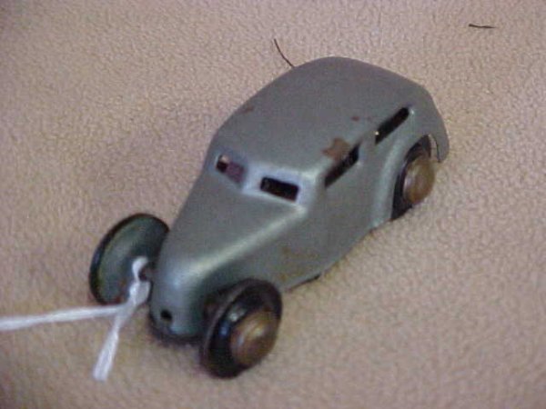 U.S. Zone Germany #363 wind up steerable car.: U.S. Zone Germany #363 wind up steerable car. Normal paint scratches & wear from age & usage. Measures 3-1/4"long x 1-1/4"tall x 1"wide.