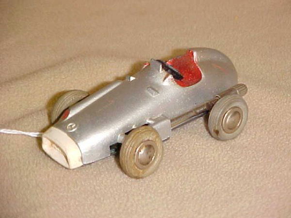 1950's Schuco Micro racer #1043: 1950's Schuco Micro racer #1043. Minor scratches & wear from age & usage. Measures 4"long x 1-1/2"tall x 2"wide.