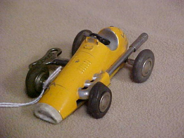 Schuco Micro racer #1040: Schuco Micro racer #1040. Minor wear from age & usage. Measures 3-1/2"long x 1-1/2"tall x 2"wide.