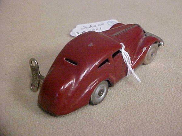 Schuco #1001 Wind up car: Schuco #1001 Wind up car. Minor wear from age & usage. Measures 4-1/2"long x 1-1/2"tall x 1-1/4"wide.