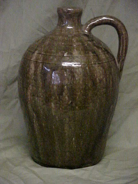 Lanier Meaders 1/2 gallon alkaline glaze jug.: Lanier Meaders 1/2 gallon alkaline glaze jug. Has a firing flaw on the side. Signed, no other damage. Measures 10-1/2" x 7".