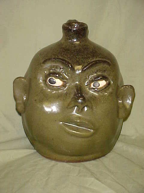 Rare Pixie Lanier Meaders face jug: Rare Pixie Lanier Meaders face jug. Important Lanier Meaders face jug w/no teeth, very few examples know to exist in the female form. This is an early Lanier example hard to find pointy nose & ears. C
