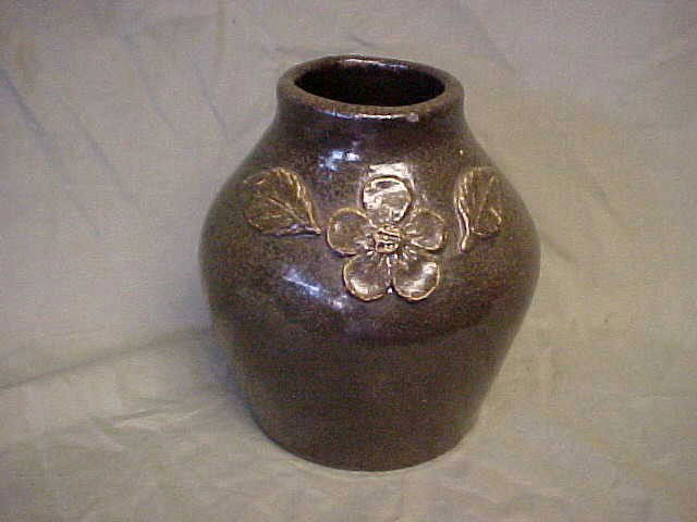 Arie Meaders dogwood decorated vase.: Arie Meaders dogwood decorated vase, turned by Lanier Meaders and hand laid, decorated dogwood. Extreamly rare. Signed on bottom AM (Arie Meaders). Very small glaze skip during firing. Measures 6-1/2"