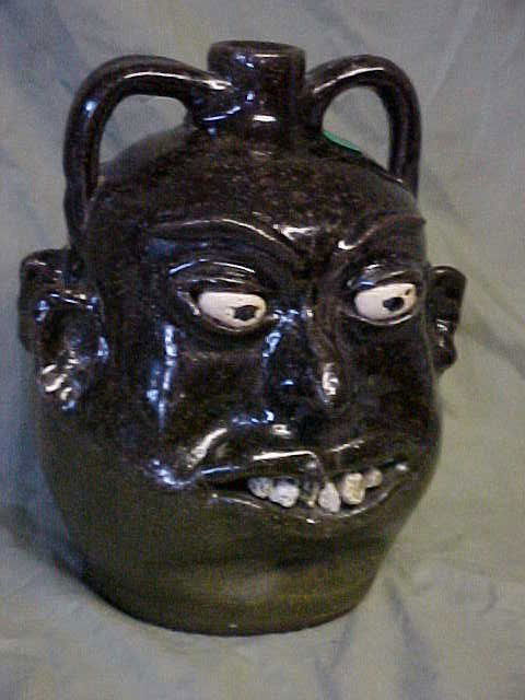 Rare Lanier Meaders double face rock teeth face ju: Rare Lanier Meaders double face rock teeth face jug. Stunning rock tooth double faced politican jug in outstanding condition. Signed on base. Extreamly rare find from this private estate collection. H