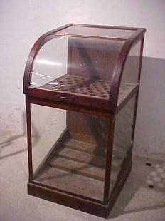 Oak Cain display case w/curved glass Chicago Il.: Oak Cain display case w/curved glass Chicagon Il. Oak case w/lift up curved glass lid. Original finish. Only damage is the lift up lid has a slight warp when closed. Measures 47-1/2"tall x 24-1/2"wide