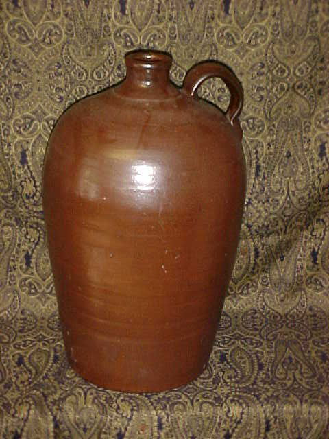 Southern pottery 4 gallon jug Robert Craven Gillsvi: Southern pottery 4 gallon jug Robert Craven Gillsville Georgia. Marked with Cravens signature 4 mark. No name. Attributed to Craven. Has large chip on bottom. Measures 16"tall x 10-1/2"wide.