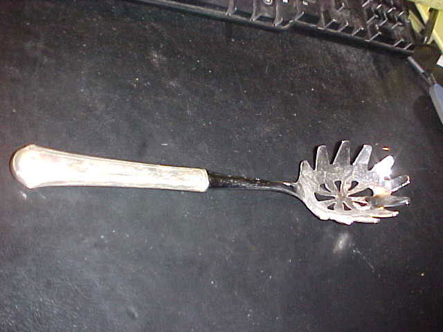 Towle Sterling silver pasta serving utensil.: Towle Sterling silver pasta serving utensil. The signature of Towe Sterling is marked on the back side of the serving end. Only the handle is sterling. 10-1/2"long. Minor scratches from age & usage.
