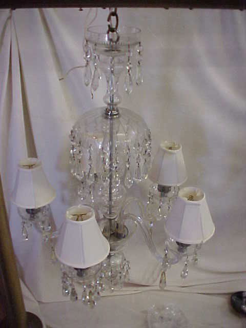 Fantastic crystal chandlier. 5 arm light.: Fantastic crystal chandlier. 5 arm light. Did not see a signature, but by the quality of this light it should be signed. Crystal cap on top. 5 crystal arms loaded with crystal prsims. Wonderful light