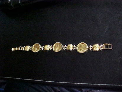 Gold bracelet w/3 1999 $5 Liberty gold coins.: Gold bracelet w/3 1999 $5 liberty gold coins. The coins weight 1/10 oz each (9.4 grams) 22kt. Bracelet(21 grams)14kt. Total gold weight 30.4 grams. 8-1/4"long x 3/4"wide. Over 1 ounce of gold.