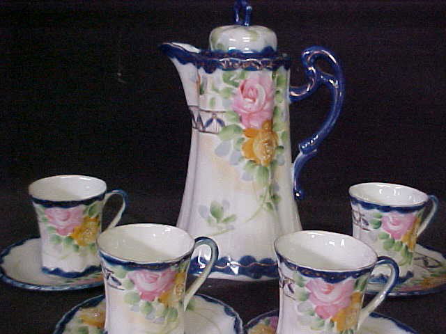 Early Cobalt blue Nippon chocolate set.: Early Cobalt blue Nippon chocolate set. Tall chocolate pot w/4 cups & saucers. Signed with green mark. No damage.