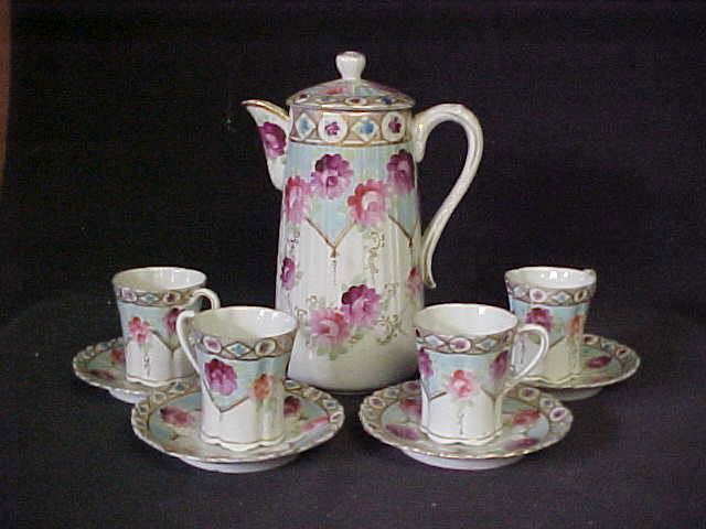 Unsigned Nippon Chocolate set, pitcher w/cups & sa: Unsigned Nippon Chocolate set, pitcher w/cups & saucers. Handpainted floral decorations. No damage.