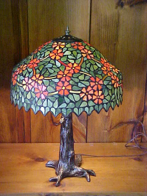 Lg. Floral Design Tiffany Style Lamp: Quality Reproduction Lg. Floral Design Tiffany Style Leaded Glass Lamp w/ Bronze Tree Design Base Measures 15 1/2" x 24"high